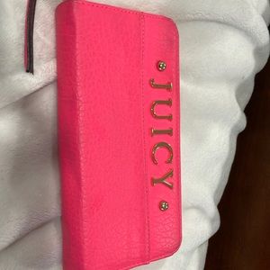 Used juicy pink wallet. Shows a little wear no rips few marks